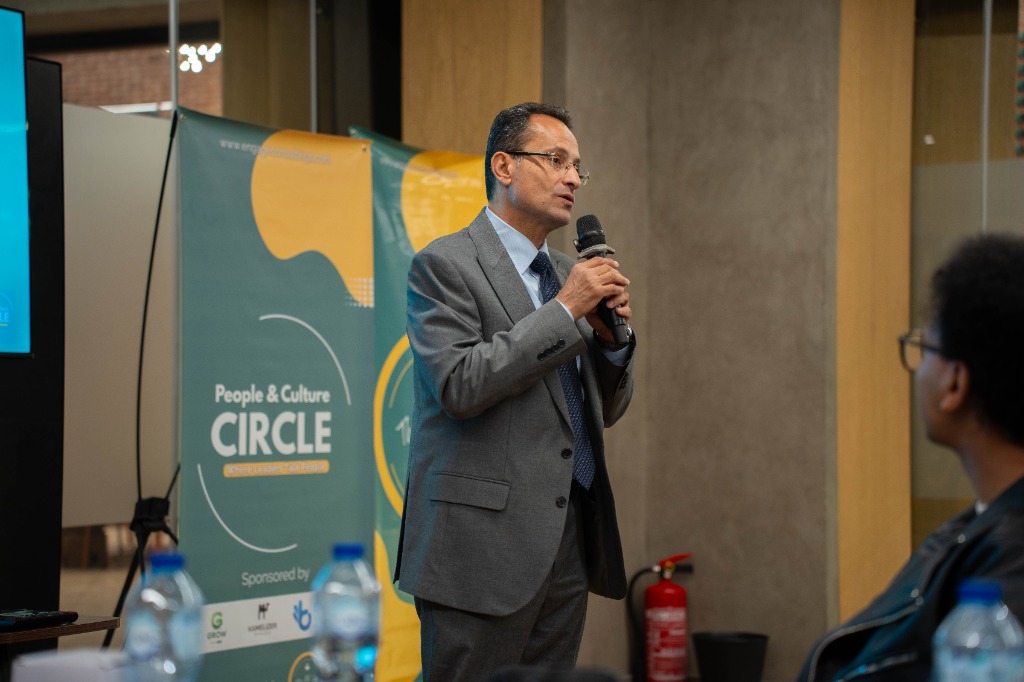 Dr. Hazem Halim speaking at podium