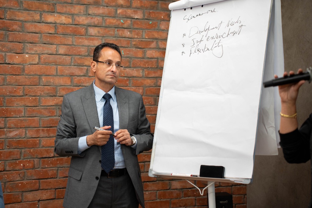 Dr. Hazem Halim next to flipchart