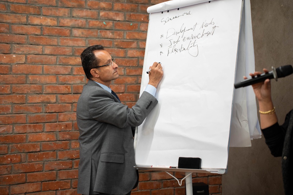 Dr. Hazem Halim writing on whiteboard