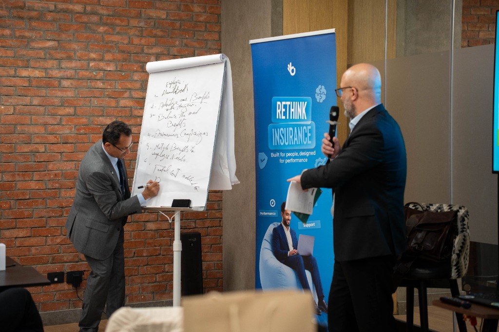 Dr. Hazem Halim writing on whiteboard